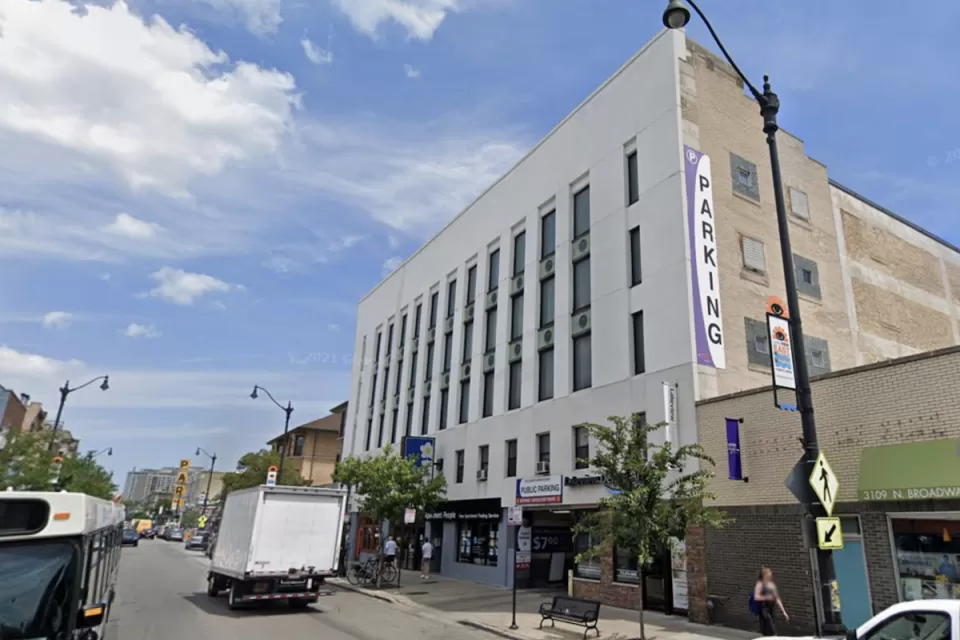 Google street view of white parking garage building in Chicago in 2018 prior to conversion to apartments